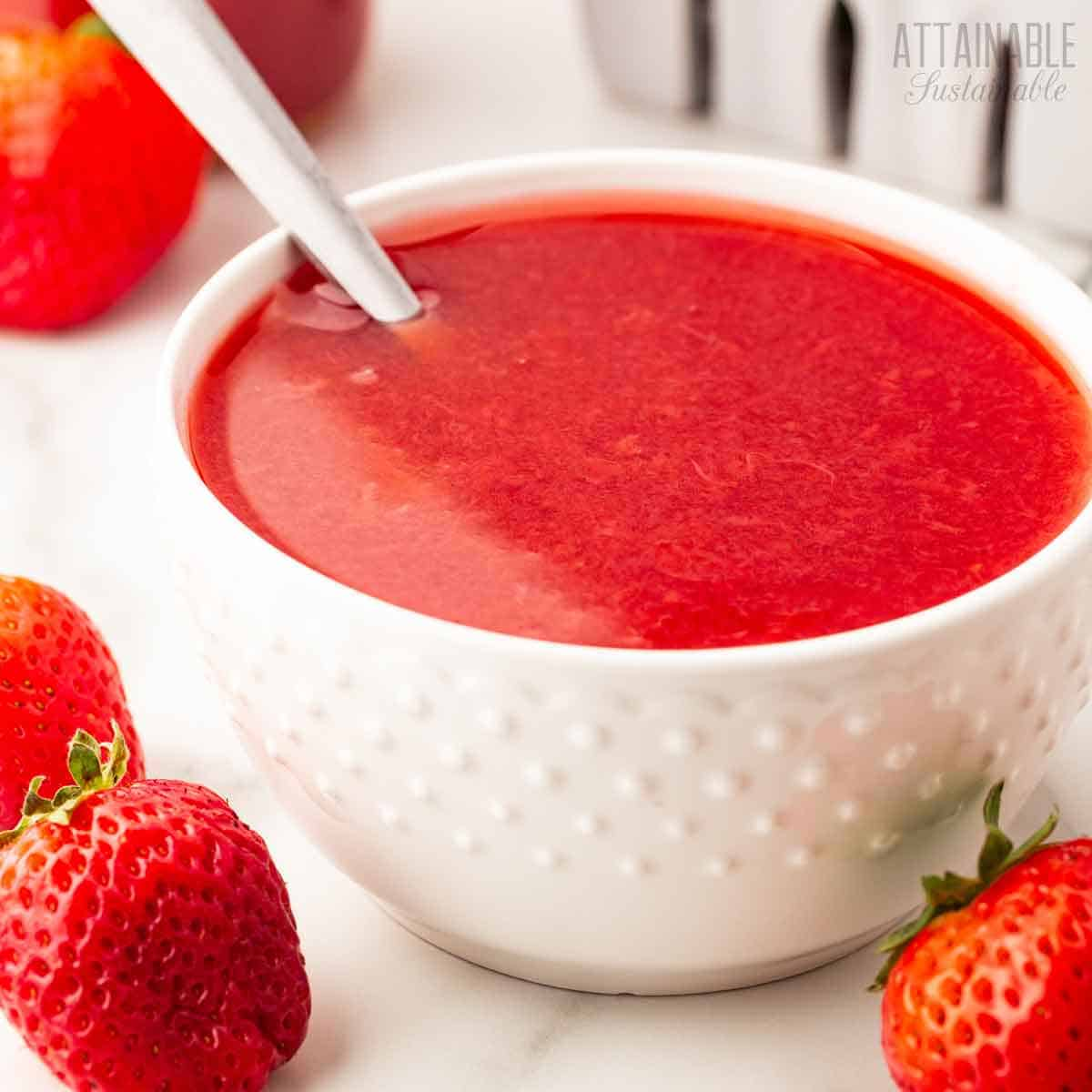 dotted white bowl full of strawberry puree.