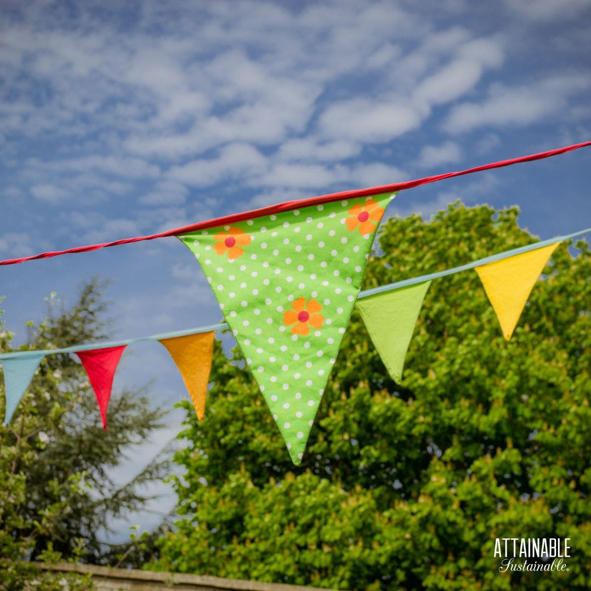 cloth banner against a blue sky background.