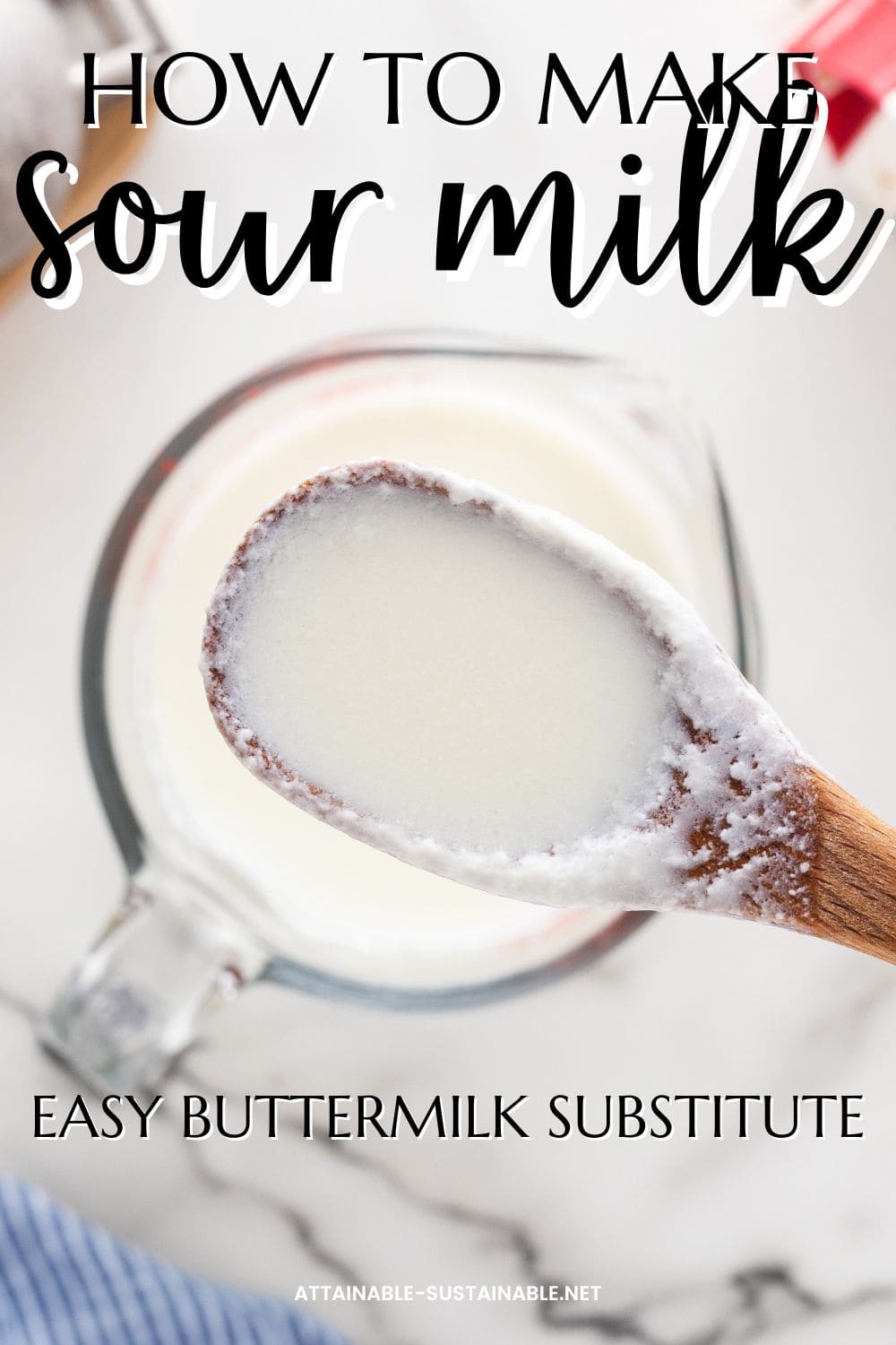 wooden spoon full of sour milk hovering above a measuring cup full of white liquid.