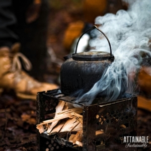 tea pot steaming over an open fire.