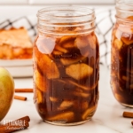 pint jar full of rich brown apple pie filling.